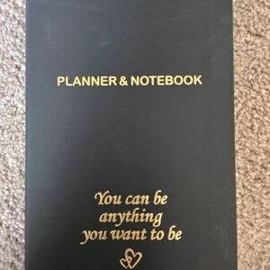 New in package-Stylish black/gold daily planner.